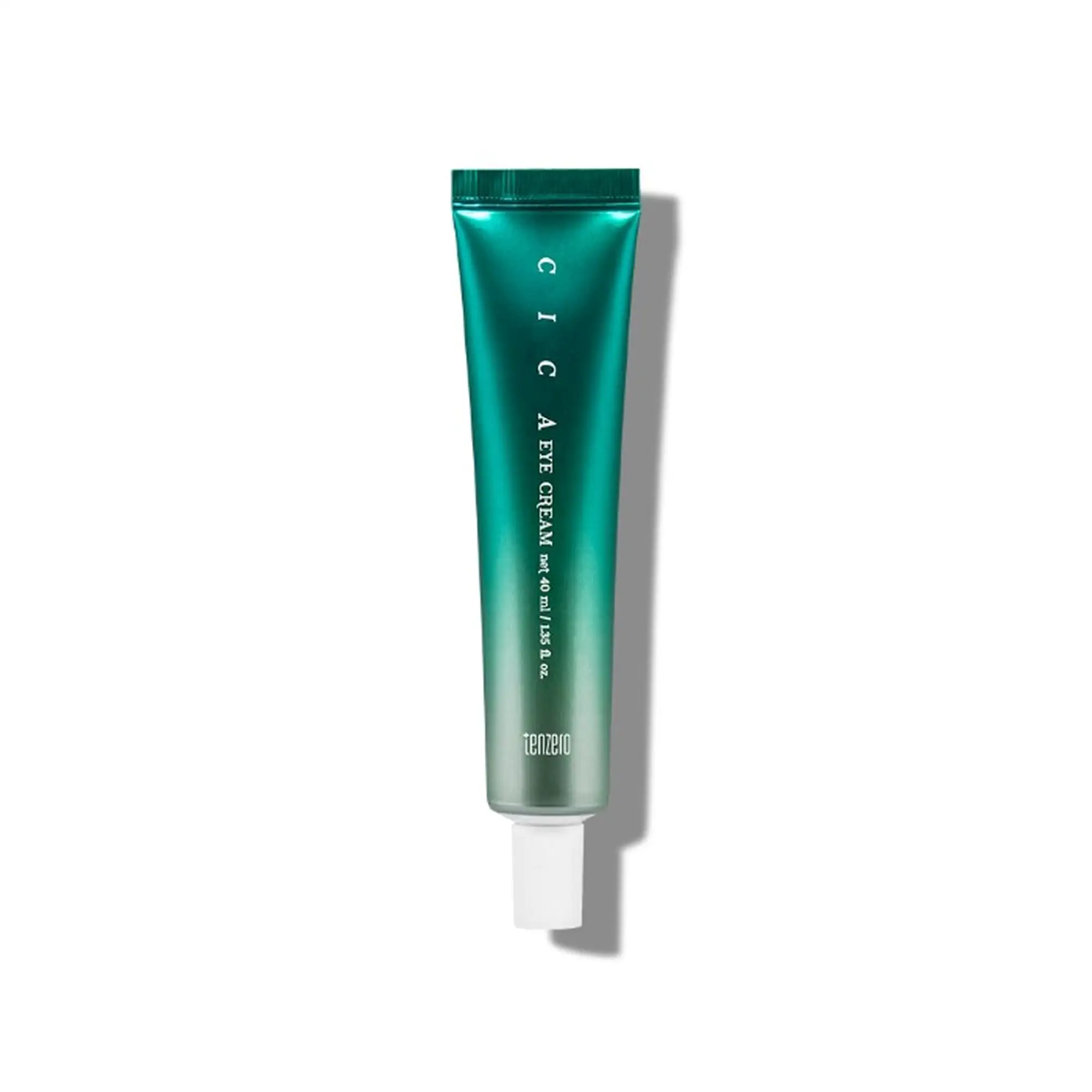 Teal squeeze tube of cream with a white cap, partially visible, on white background with a shadow to the right